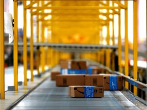 Packages make their way along a conveyor belt at Amazon's new warehouse near Mexico City.