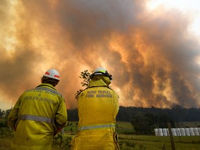 Smoke from a large bushfire is seen outside Nana Glen, near Coffs Harbour, Australia, Nov. 12, 2019.