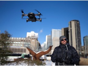 A drone operator flies his drone as Chinese drone maker DJI holds a demonstration to display an app that tracks a drone's registration and owner in Montreal, Canada, November 13, 2019.