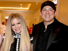 Avril Lavigne and Phillip Sarofim. (Getty Images file photo)