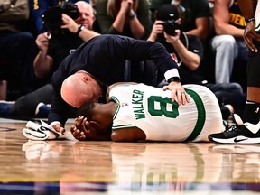 Boston Celtics guard Kemba Walker following a injury in the second quarter against the Denver Nuggets at the Pepsi Center.