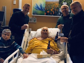 Norbert Schemm has a final beer with his three sons before he died earlier this month.