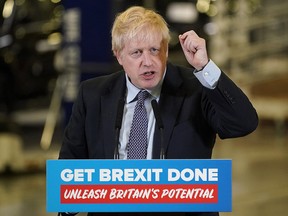 British Prime Minister Boris Johnson delivers his first major speech of the Conservatives' election campaign as he visits the London Electric Vehicle Company (LEVC) on November 13, 2019 in Coventry. (Christopher Furlong/Getty Images)