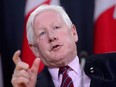 In this April 3, 2018, file photo, Canadian special envoy Bob Rae releases a report on the humanitarian and security crisis in Myanmar at a press conference in Ottawa.