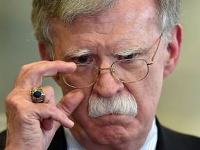 In this file photo taken on Aug. 29, 2019, U.S. National Security Advisor John Bolton answers journalists questions in Minsk.