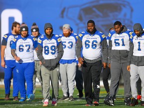 From left: Blue Bombers’ Asotui Eli, Kenny Lawler, Patrick Neufeld, Stanley Bryant, Jermarcus Hardrick and Darvin Adams gather during the team’s final walkthrough on Saturday in preparation for Sunday's Grey Cup game against the Hamilton Tiger-Cats in Calgary. (AL CHAREST/POSTMEDIA NETWORK)