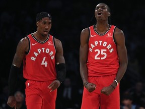 Raptors’ Rondae Hollis-Jefferson (left) and Chris Boucher celebrate during Toronto’s win over the Lakers in Los Angeles on Sunday. Both players have been solid for the Raps, who are currently without several key players due to injuries.