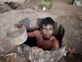 Paulo Paulino Guajajara was hunting on Friday Nov 1 inside the Arariboia reservation in Maranhao state when he was attacked and killed by illegal loggers. He was an indigenous Indian "forest guardian," seen here drawing water from a well at a loggers camp on Arariboia indigenous land near the city of Amarante, Maranhao state, Brazil, September 11, 2019.