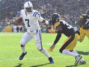Indianapolis Colts quarterback Jacoby Brissett is pursued by Pittsburgh Steelers linebacker Bud Dupree during the first quarter at Heinz Field in Pittsburgh on Nov. 3, 2019.