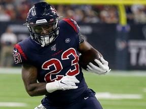 Texans running back Carlos Hyde carries the ball during NFL action against the Colts at NRG Stadium in Houston on Thursday, Nov. 21, 2019.