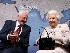 David Attenborough sits next to Britain's Queen Elizabeth during the annual Chatham House award in London, Britain November 20, 2019.