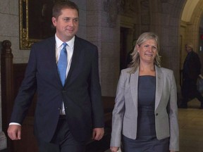 Leader of the Opposition Andrew Scheer walks with Leona Alleslev, who crossed the floor from the Liberal party to Conservative party before Question Period on Parliament Hill in Ottawa, Monday, September 17, 2018.
