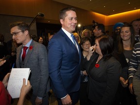 Conservative leader Andrew Scheer passes caucus members after speaking to reporters following a caucus meeting on Parliament Hill in Ottawa, on Wednesday, Nov. 6, 2019.