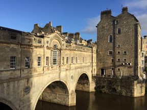 Bath's lovely Pulteney Bridge spans the River Avon. Lined with shops, it is fashioned after the Ponte Vecchio in Florence. ROBIN ROBINSON