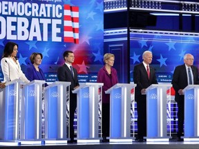 Democratic presidential candidates Tulsi Gabbard, Amy Klobuchar, Pete Buttigieg, Elizabeth Warren, Joe Biden and Bernie Sanders participate in the Democratic Presidential Debate at Tyler Perry Studios in Atlanta, on Wednesday, Nov. 20, 2019.