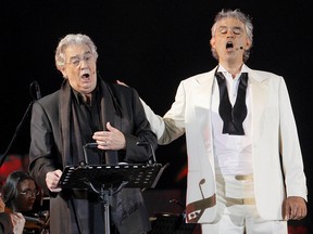 Italian opera tenor Andrea Bocelli (R) and Placido Domingo sing  during the annual concert at the Theatre of the Silence on July 18, 2009, in Lajatico a comune of Pisa.