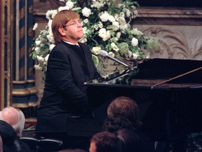 Elton John plays a specially re-written version of his song "Candle in the Wind" during the funeral service for Diana, Princess of Wales, at London's Westminster Abbey in this Saturday, Sept. 6, 1997 file photo. (AP Photo/Paul Hackett, Pool)