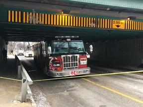 A fire truck is stuck under a bridge after being stolen in Winnipeg on Friday, November 29, 2019.