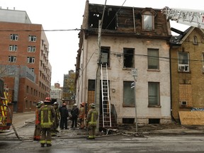One Toronto firefighter suffered a broken leg and another was critically injured when they plummeted from the roof of a three-storey derelict building on Shuter St. while battling a four-alarm blaze on Saturday Nov. 2, 2019.