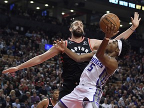 Sacramento Kings guard De'Aaron Fox shoots the ball as Toronto Raptors centre Marc Gasol defends in the first half at Scotiabank Arena in Toronto on Nov. 6, 2019.