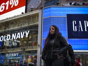 Pedestrians walk past Old Navy and Gap stores in Times Square, March 1, 2019 in New York City.