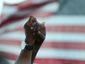 People hold a vigil on the Arthur Ravenel Jr. bridge on June 21, 2015 in Charleston, South Carolina. (Joe Raedle/Getty Images)