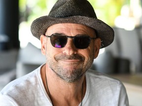 In this file photo taken on July 19, 2019 Guy Laliberte, founder of the Cirque du Soleil and owner of the private island of Nukutepipi, in the French Polynesia archipelago of Tuamotu, poses in the resort.