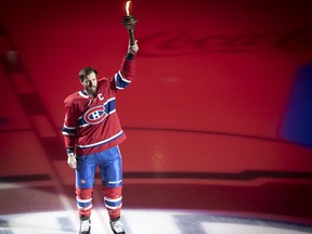 Shea Weber raises torch during opening ceremony at the Bell Centre on Oct. 10, 2019.