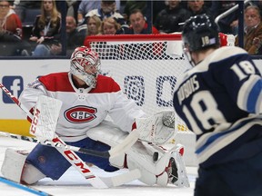 Canadiens goalie Carey Price makes a pad save from on Blue Jackets centre Pierre-Luc Dubois during first-period action Tuesday night.