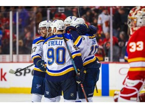 St. Louis Blues left wing David Perron celebrates his goal with teammates against the Calgary Flames during the overtime period at Scotiabank Saddledome in Calgary on Nov. 9, 2019.