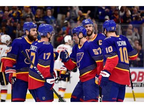 Nov 21, 2019; St. Louis, MO, USA; St. Louis Blues left wing David Perron (57) celebrates with center Jaden Schwartz (17) after scoring during the second period against the Calgary Flames at Enterprise Center. Mandatory Credit: Jeff Curry-USA TODAY Sports ORG XMIT: USATSI-405331