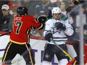 Calgary Flames, Milan Lucic battles Dallas Stars, Alexander Radulov in first period action of at the Scotiabank Saddledome in Calgary on Wednesday, Nov.13, 2019.