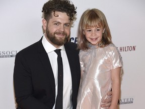 Jack Osbourne, left, and his daughter Pearl arrive at the 25th annual Race to Erase MS Gala at The Beverly Hilton hotel on April 20, 2018, in Beverly Hills. (Chris Pizzello/Invision/AP)