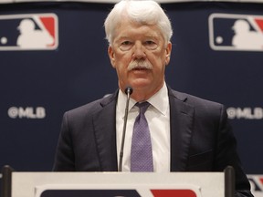New Kansas City Royals owner John Sherman makes a brief statement to reporters after the owners meeting in Arlington, Texas, Thursday, Nov. 21, 2019. (AP Photo/LM Otero)