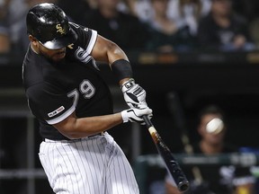Chicago White Sox's Jose Abreu hits a home run against the Los Angeles Angels Saturday, Sept. 7, 2019, in Chicago. (AP Photo/Jim Young)