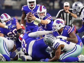 Josh Allen of the Buffalo Bills lunges to get a first down against the Dallas Cowboys at AT&T Stadium on November 28, 2019 in Arlington. (Richard Rodriguez/Getty Images)