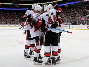 Senators forward Jean-Gabriel Pageau is congratulated by teammates after scoring in the first period of Wednesday night’s game against the Devils in Newark. Pageau finished with a hat trick. (GETTY IMAGES)