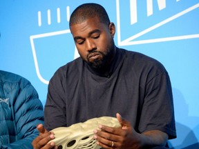 Kanye West speaks on stage at the "Kanye West and Steven Smith in Conversation with Mark Wilson" at the Fast Company Innovation Festival in New York City on Nov. 7, 2019 .