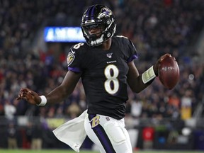 Ravens quarterback Lamar Jackson scores a first quarter touchdown against the Patriots at M&T Bank Stadium in Baltimore, on Sunday, Nov. 3, 2019.