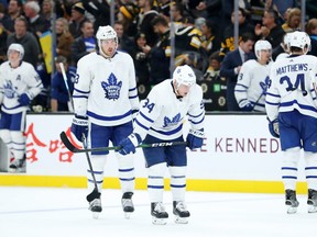 Maple Leafs’ Frederik Gauthier (left), Tyson Barrie and Auston Matthews look crestfallen following a loss in Boston last month. Toronto finished October with a record of 6-5-3 and hopes to start November with a win in Philadelphia on Saturday night.