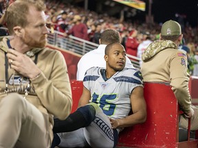 Seattle Seahawks wide receiver Tyler Lockett (16) is carted off the field during overtime against the San Francisco 49ers at Levi's Stadium. (Kyle Terada-USA TODAY Sports)
