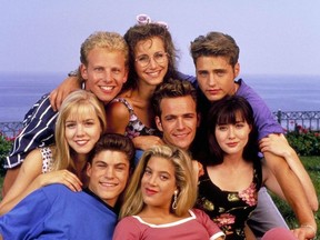 The cast of BEVERLY HILLS, 90210 in the early days. (Clockwise: Gabrielle Carteris as Andrea Zuckerman, Jason Priestly as Brandon Walsh, Shannen Doherty as Brenda Walsh, Luke Perry as Dylan McKay, Tori Spelling as Donna Martin, Brian Austin Green as David Silver, Jennie Garth as Kelly Taylor and Ian Ziering as Steve Sanders.)