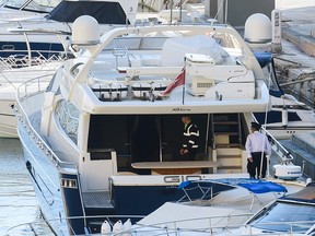 Policemen board the luxury yacht Gio, owned by Yorgen Fenech, after it was escorted back into the Portomaso Marina in St Julian's, Malta, on November 20, 2019. (JONATHAN BORG/AFP via Getty Images)