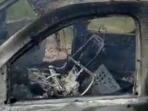 The burnt wreckage of a vehicle transporting a Mormon family living near the border with the U.S. is seen, after the family was caught in a crossfire between unknown gunmen from rival cartels, in Bavispe, Sonora, Mexico Nov. 4, 2019, in this picture obtained from social media.