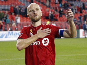 Toronto FC midfielder Michael Bradley (4) acknowledges the fans after a win over Colorado Rapids at BMO Field. (John E. Sokolowski-USA TODAY Sports)