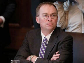 Acting White House Chief of Staff Mick Mulvaney listens during a cabinet meeting held by U.S. President Donald Trump at the White House in Washington, D.C., on Oct. 21, 2019.
