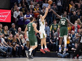 Utah Jazz forward Bojan Bogdanovic shoots a three-point shot over Milwaukee Bucks forward Khris Middleton at the buzzer to win the game at Vivint Smart Home Arena in Salt Lake City, Utah, on Nov. 8, 2019.