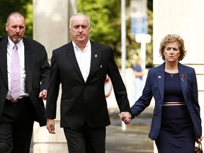 The parents of Grace Millane, David and Gillian Millane, arrive with Detective Inspector Scott Beard (left) at the Auckland High Court on November 6, 2019 in Auckland, New Zealand. (Phil Walter/Getty Images)