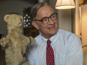 This image released by Sony Pictures shows Tom Hanks as Mr. Rogers in a scene from "A Beautiful Day In the Neighborhood.” (Lacey Terrell/Sony-Tristar Pictures via AP)
