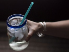 A plastic straw is pictured in a cold drink in North Vancouver, B.C., Thursday, June, 7, 2018.
